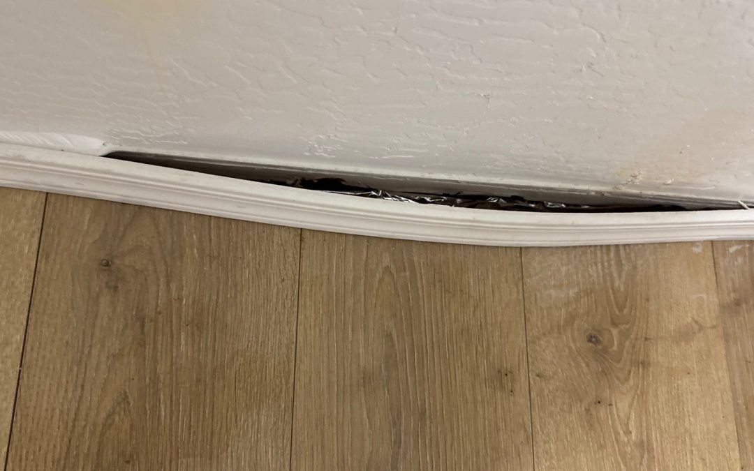 Why Baseboards Bow Away from Drywall After Water Damage in Goodyear, AZ